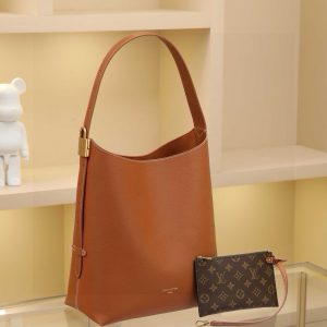 Alternative view of Low Key Hobo Medium Handbag Crafted from supple cowhide leather with clean, understated lines, this piece features a suede lining that exudes contemporary flair, showcasing the brand's masterful craftsmanship. An adjustable shoulder strap is accented with a signature padlock, while ample interior space easily accommodates daily essentials like a laptop. Dimensions: 31.0 x 35.0 x 18.0 cm